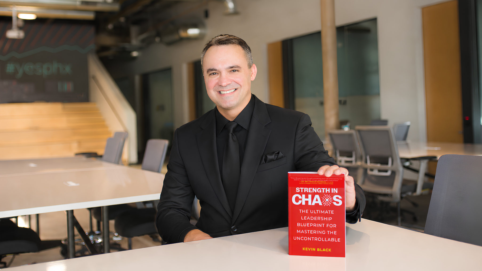 Kevin Black with copies of Strength in Chaos