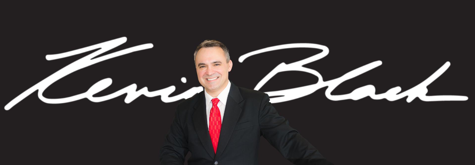 Kevin Black in front of his signature